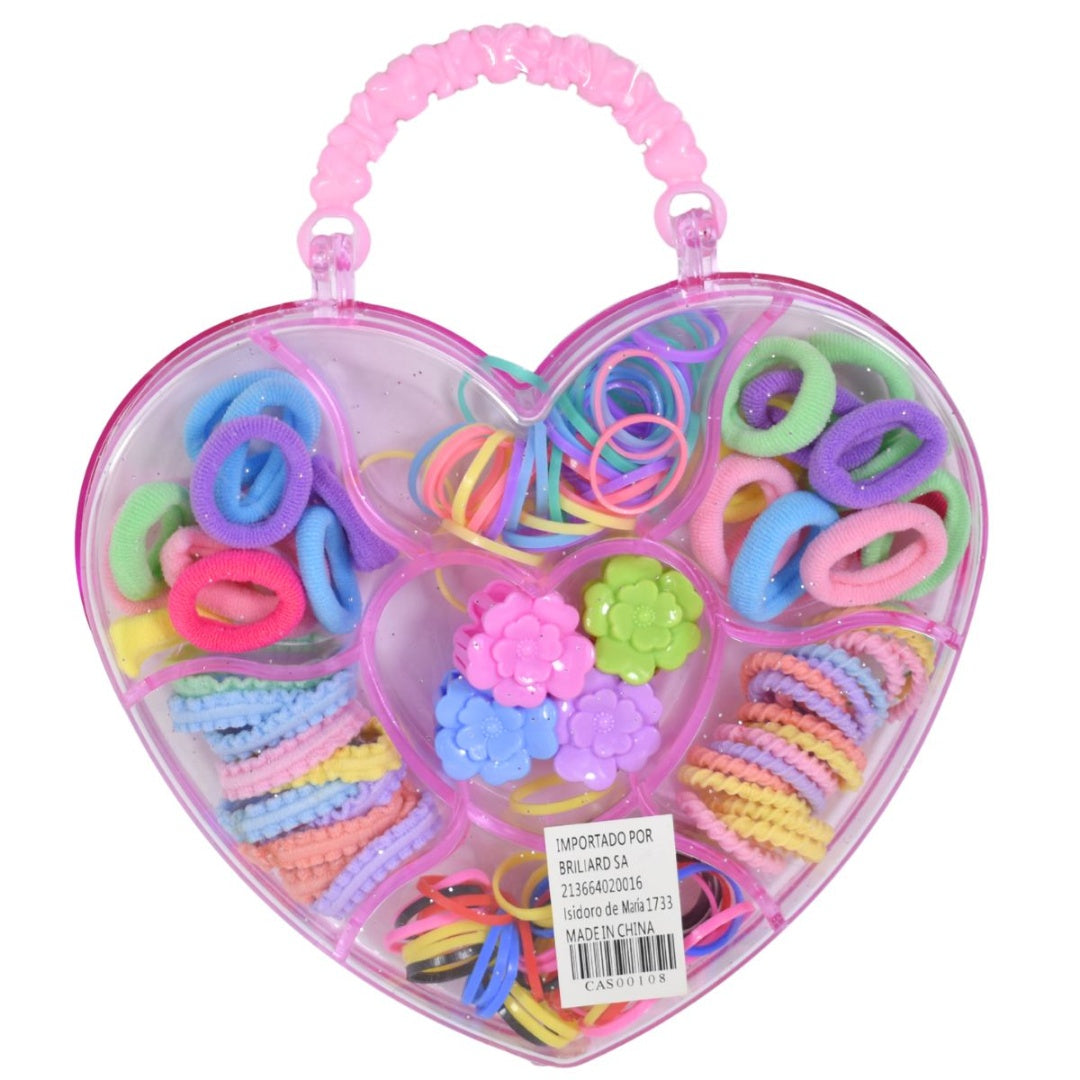 Accesorios de pelo en estuche plástico corazón 17x14cm.