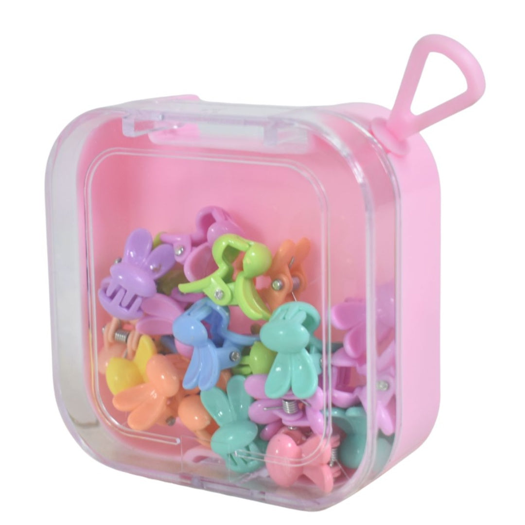 Mini broches de pelo en estuche plástico 7x7x3cm.